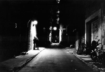 View of illuminated street lights at night