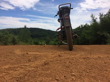 Tractor on field against sky