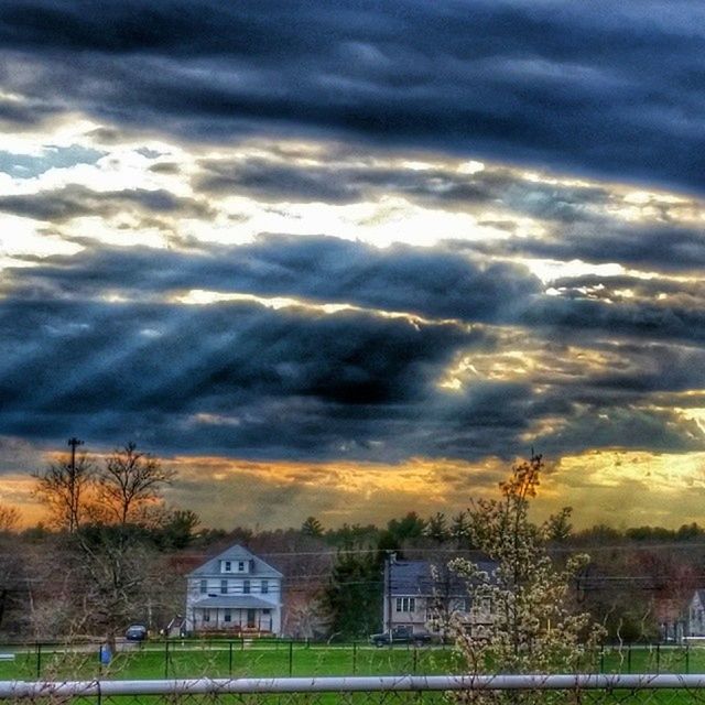 sky, sunset, cloud - sky, cloudy, building exterior, scenics, architecture, beauty in nature, built structure, dramatic sky, weather, tree, tranquil scene, landscape, field, tranquility, house, cloud, orange color, nature