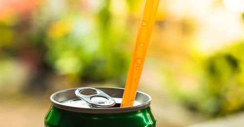 Close-up of straw in drink can