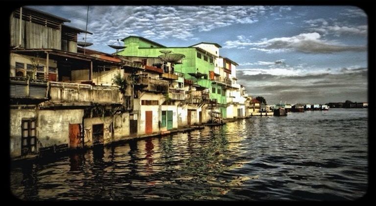 architecture, built structure, building exterior, water, transfer print, waterfront, auto post production filter, sky, canal, house, river, residential structure, transportation, residential building, nautical vessel, cloud - sky, town, cloud, building, day