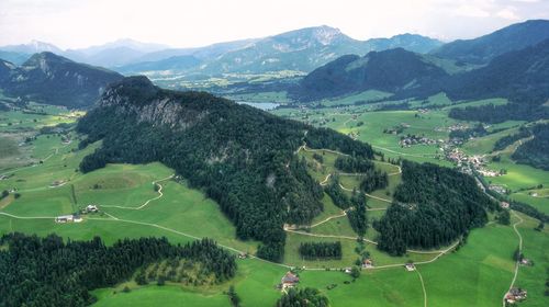 High angle view of trees on field against mountains