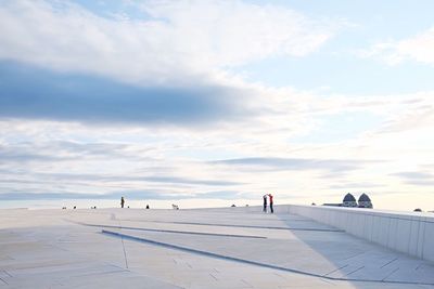 Man and woman against sky