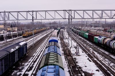 High angle view of train at railroad station against sky