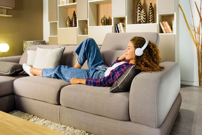 Man relaxing on sofa at home