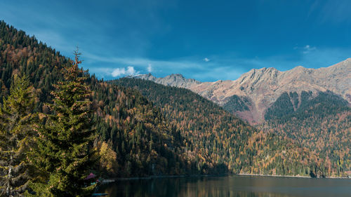 Scenic view of lake and mountains against sky
