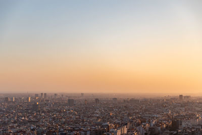 High angle view of city at sunset