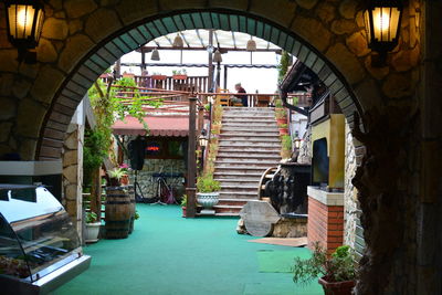 Illuminated restaurant by building