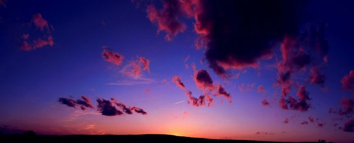 Low angle view of dramatic sky at sunset