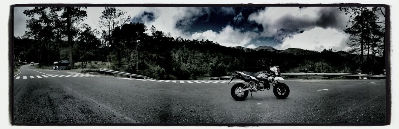 transportation, bicycle, land vehicle, mode of transport, road, sky, street, riding, tree, stationary, parked, cloud - sky, parking, dirt road, mountain, car, cycling, auto post production filter, transfer print, the way forward