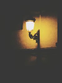 Low angle view of illuminated light bulb