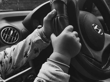 Midsection of man sitting in car