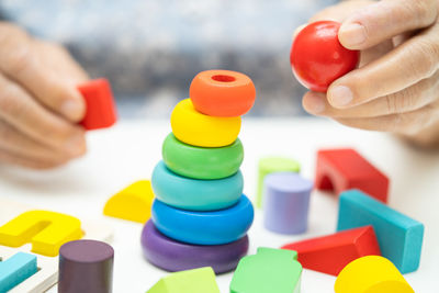 Close-up of hand holding toy blocks