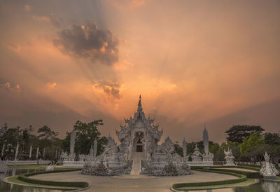 Panoramic view of temple building against sky during sunset