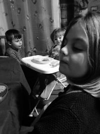 Portrait of boy sitting at home