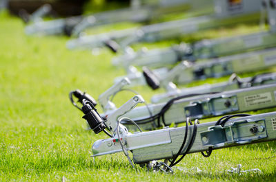 Close-up of machinery on grassy field