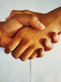 High angle view of hand holding hands