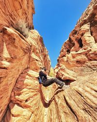 Low angle view of rock formation against clear sky