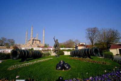 Statue in park against clear sky