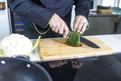 Man preparing food on cutting board