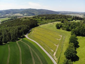 High angle view of trees on field against sky