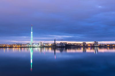 Long exposure photo of a beautiful sunset at lacul morii lake with urban buildings in the background