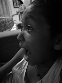 Close-up of boy shouting at home