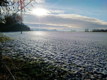 Scenic view of landscape against sky during winter