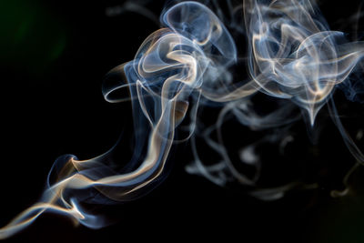 Close-up of smoke against black background