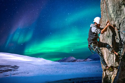 Man standing on mountain road during winter