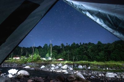 Scenic view of landscape against sky at night