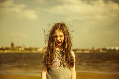 Portrait of cheerful girl screaming