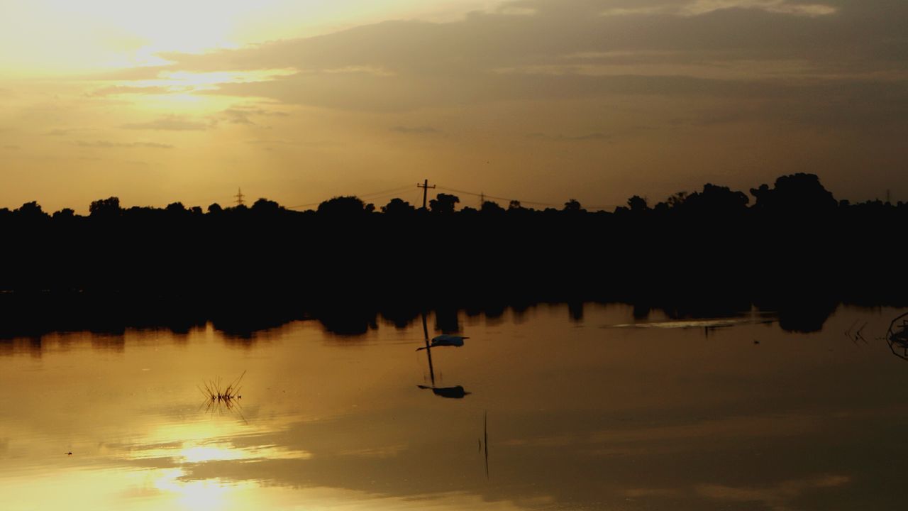 reflection, sunset, sky, water, silhouette, lake, nature, scenics, tranquility, outdoors, beauty in nature, tree, idyllic, tranquil scene, waterfront, cloud - sky, no people, sun, day