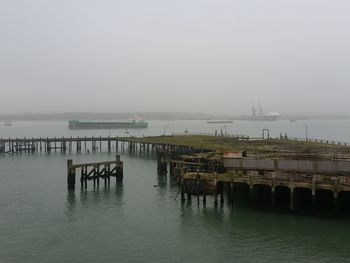 Pier on sea against sky