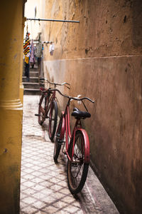 Bicycle leaning on wall