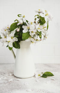 Close-up of white flower vase on table