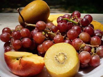 Close-up of apples in plate on table