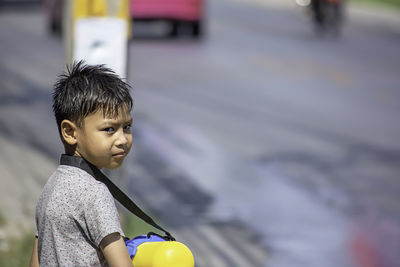 Portrait of boy standing outdoors