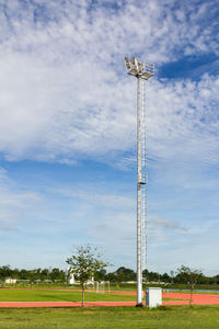 Low angle view of floodlight on field against sky