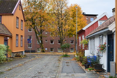 Street amidst houses and buildings in town