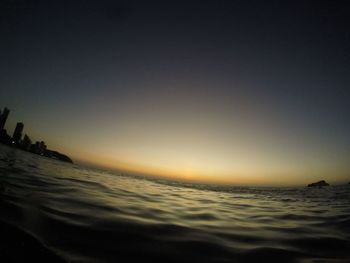 Scenic view of beach against sky during sunset