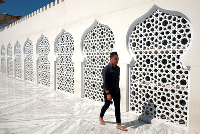 Full length of a man standing in building