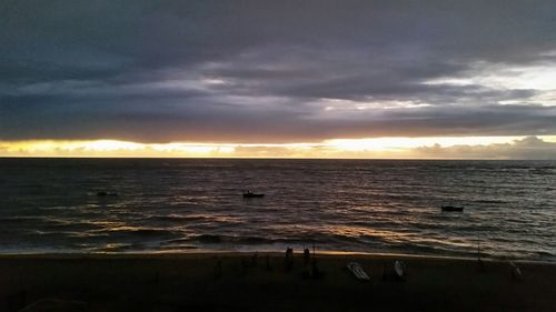 Scenic view of sea against cloudy sky