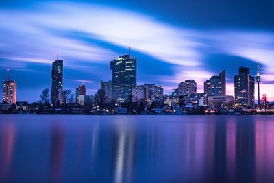 Illuminated city at waterfront