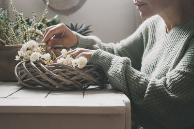 Midsection of woman holding food