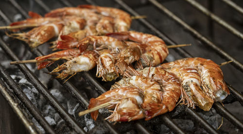 Close-up of meat on barbecue grill