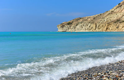 Scenic view of sea against clear blue sky