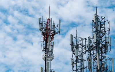 Telecommunication tower with blue sky and white clouds background. antenna on blue sky. 