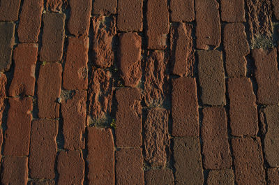 Detail of bricks in old red brick road