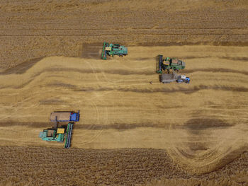 High angle view of tractors on field